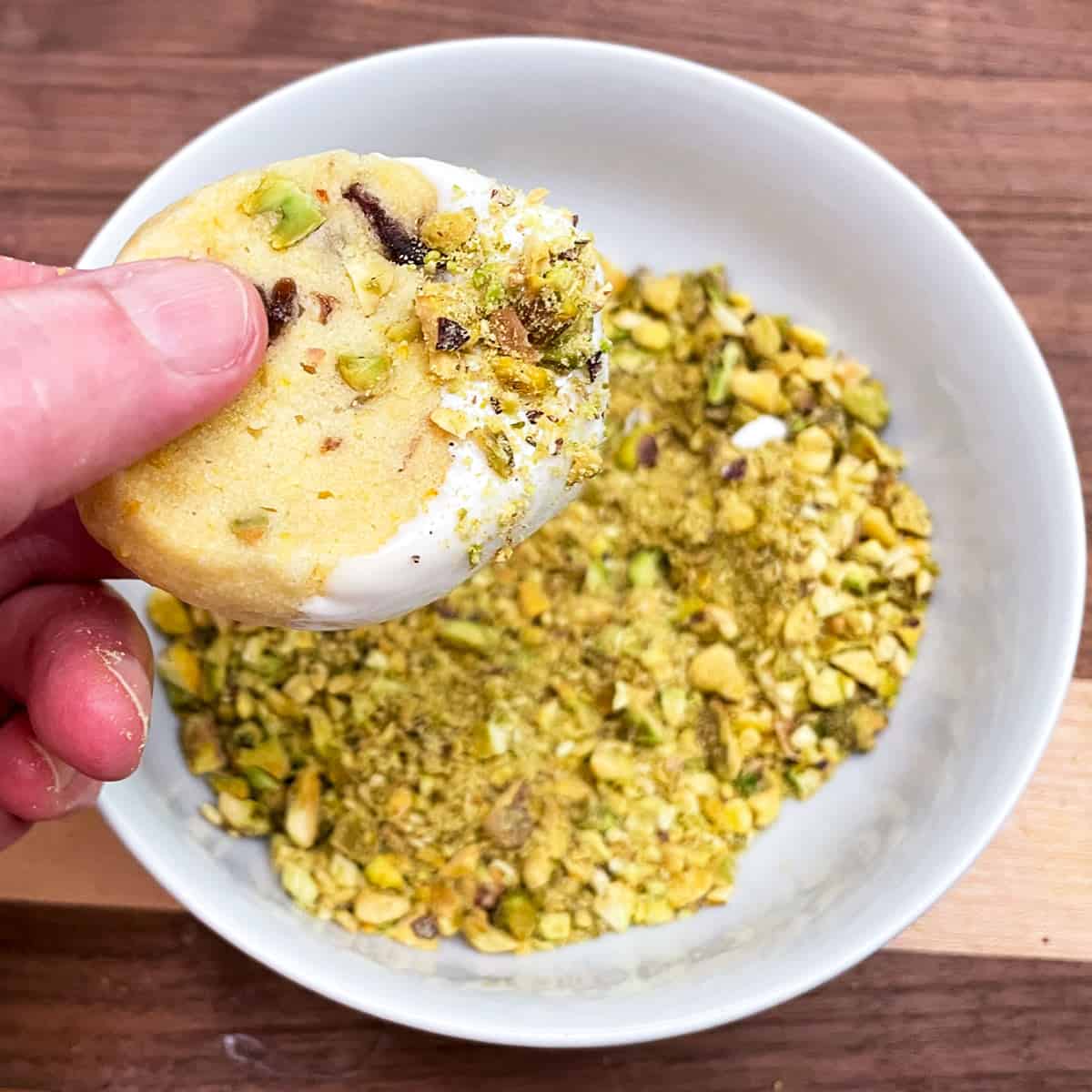 Adding small, chopped pistachios to the white chocolate that the cookie was dipped into.