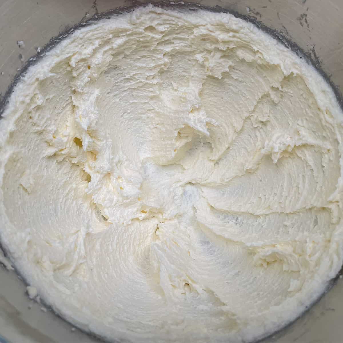 Butter and sugar mixed after three minutes, and it looks whipped and creamy.