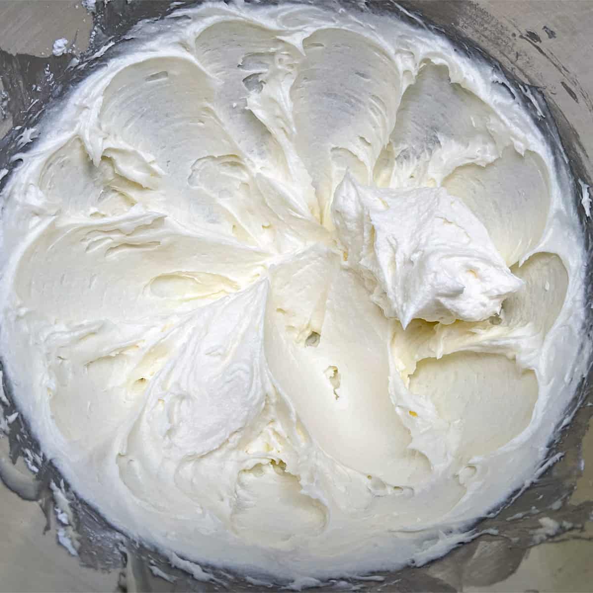 How creamy the butter, cream cheese and powdered sugar looks after mixing for a couple of minutes.