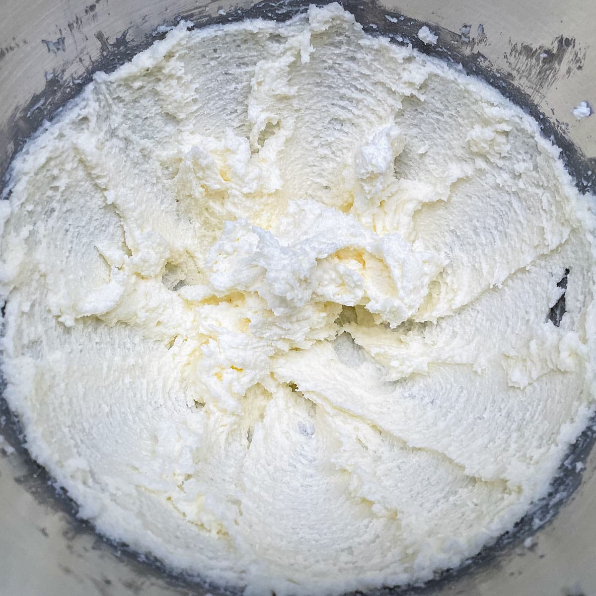 Nicely whipped butter and sugar in a mixer bowl.