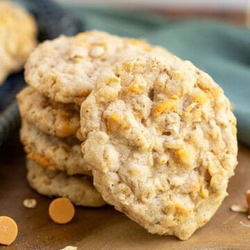 Front view of an Old Fashion Oatmeal Scotchie Cookie with a stack of the cookies behind it.