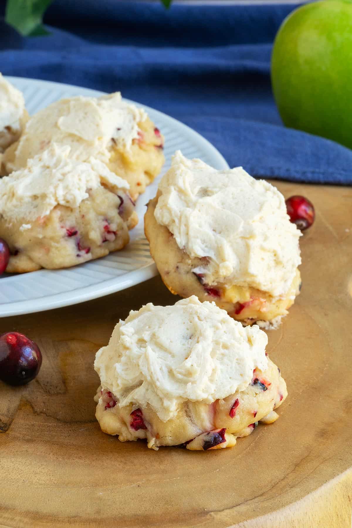 Full length phot of Fresh apple and cranberry cookies on a plate.