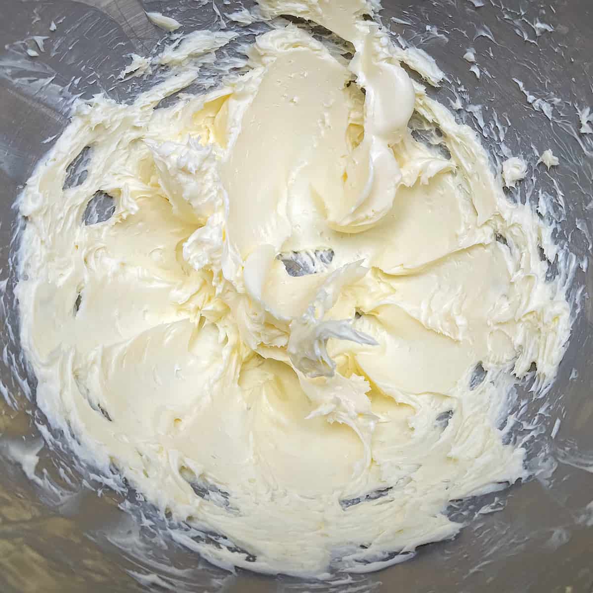 Creamed butter in a mixer bowl.