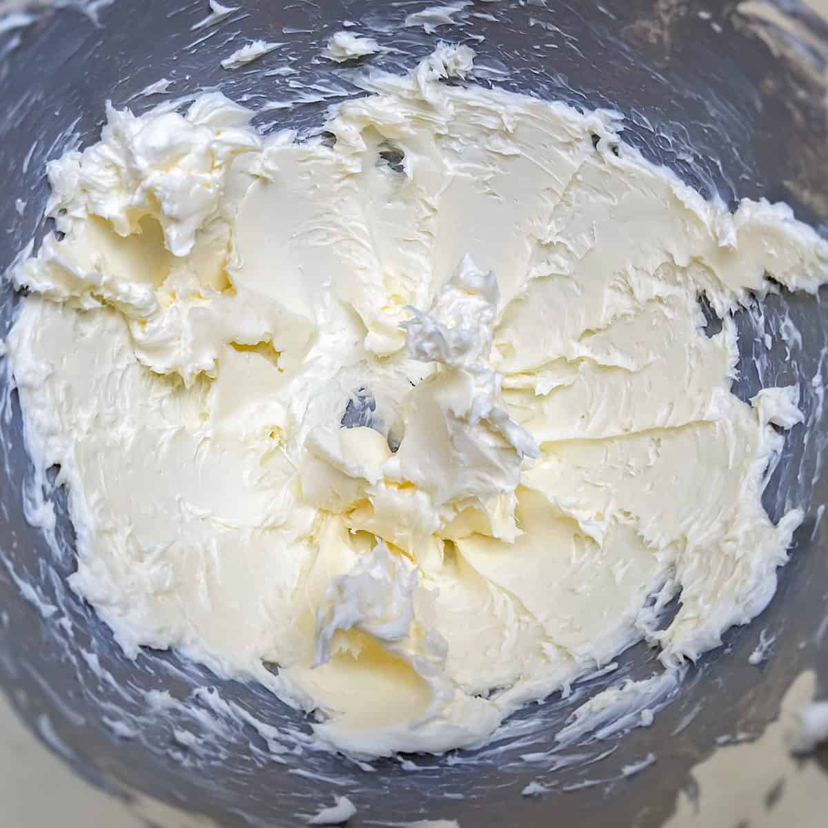 Creamed butter in a mixer bowl.