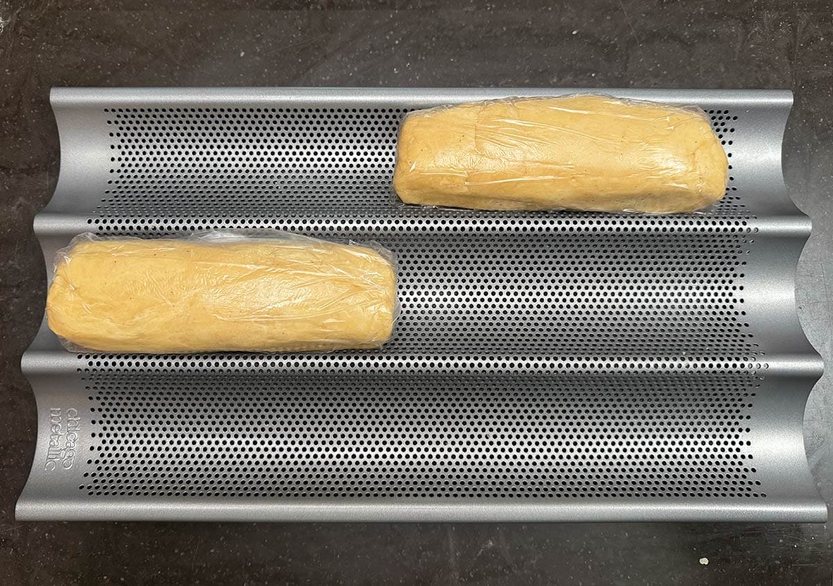 Divide the cookie dough in half, rolled and wrap into seven-inch long logs.