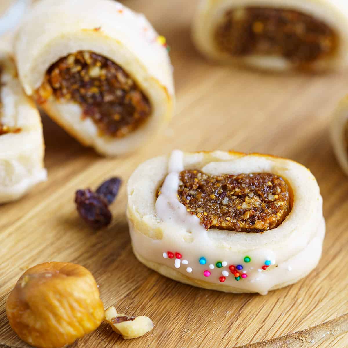 Fig cookies with vanilla glaze laying on its side.