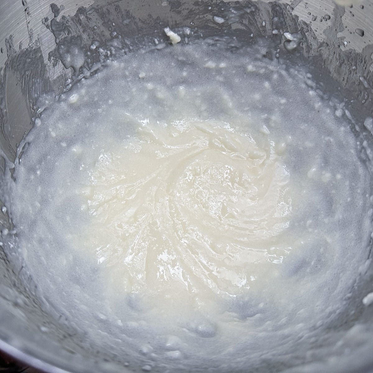 Oil and butter mixed in a mixer bowl.