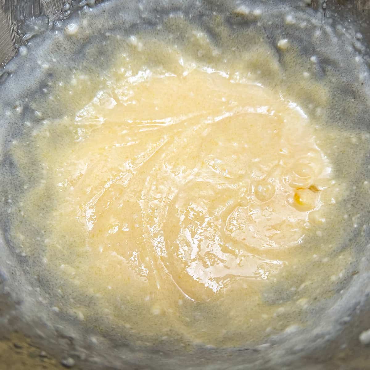 Vanilla extract and egg are added to the butter and oil.