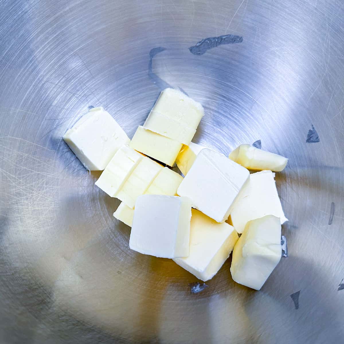 Butter cut into cubes and in a mixer bowl.