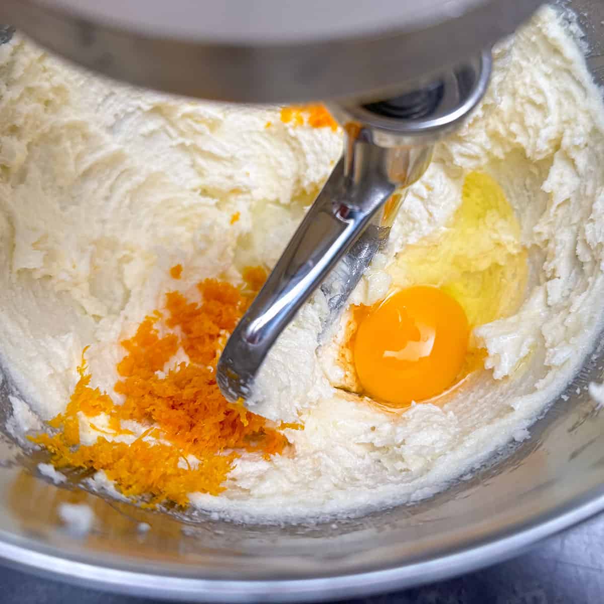Orange zest, egg and orange extract added to butter-sugar mixture.