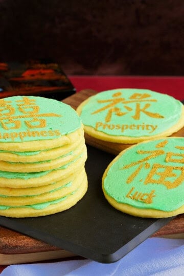 Orange Sugar Cookies with Orange Buttercream icing decorated with colors for the Chinese New Year.