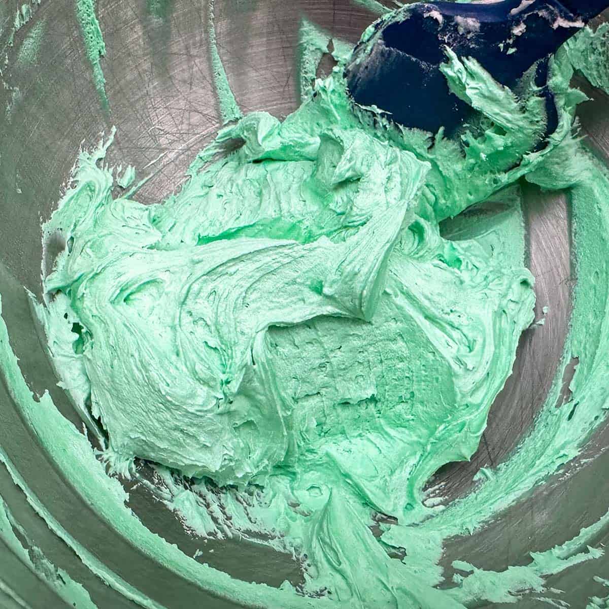 Finished green colored orange buttercream icing.