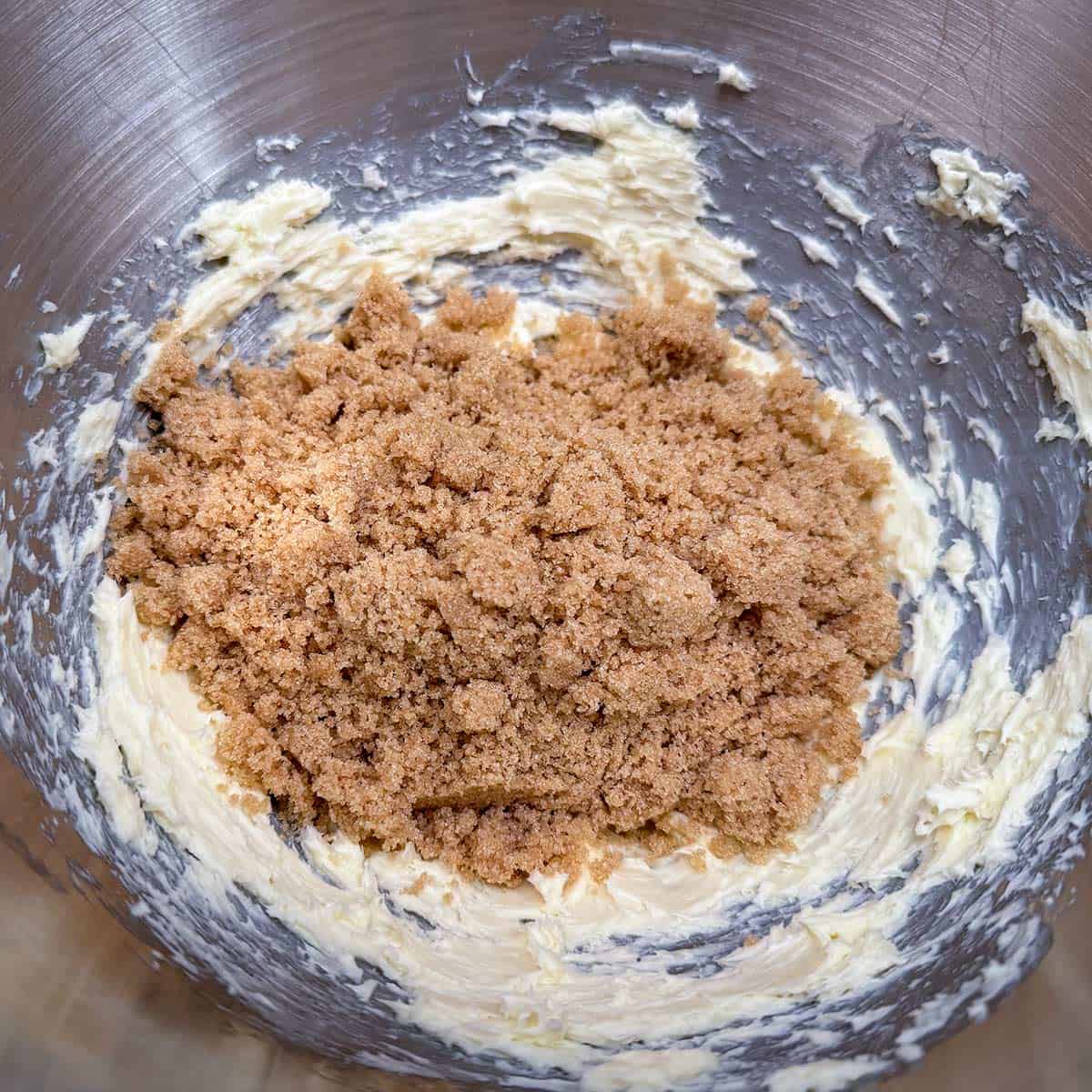 The butter is creamed and now adding the brown sugar.