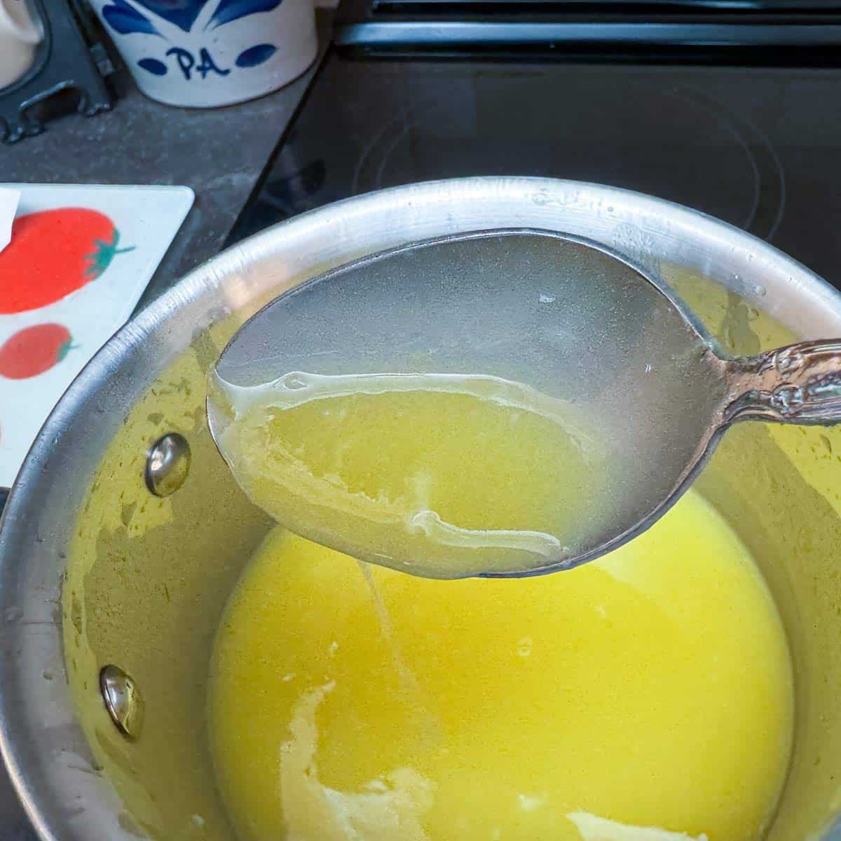 Lemon curd thickened after cooking on the stove in a saucepan.