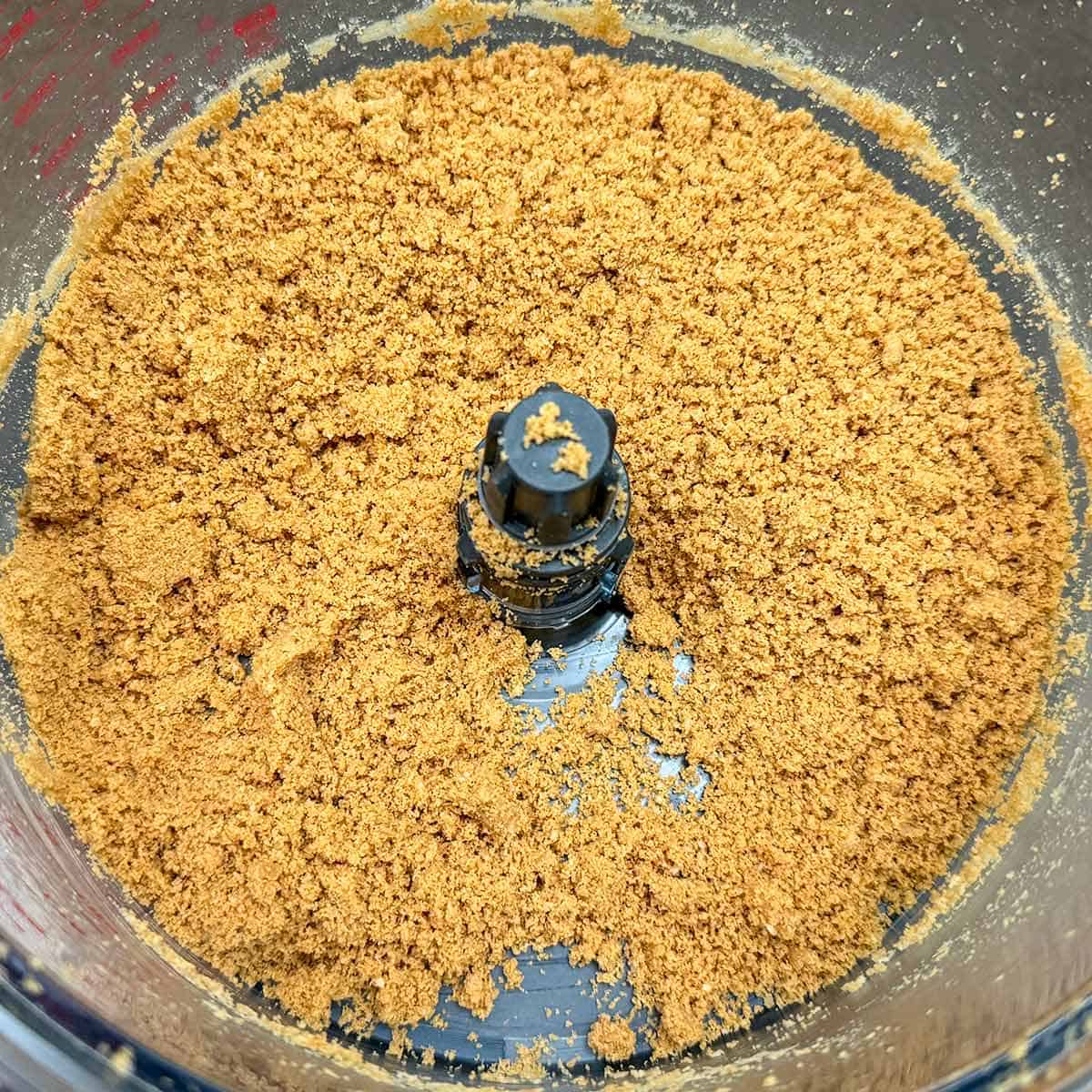 Macadamia nuts and graham crackers pulsed with a food processor into small crumbs.