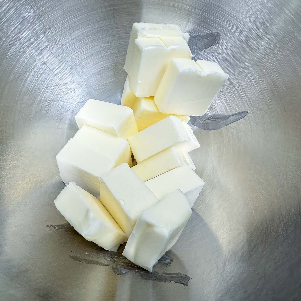 Softened butter in a mixer bowl.