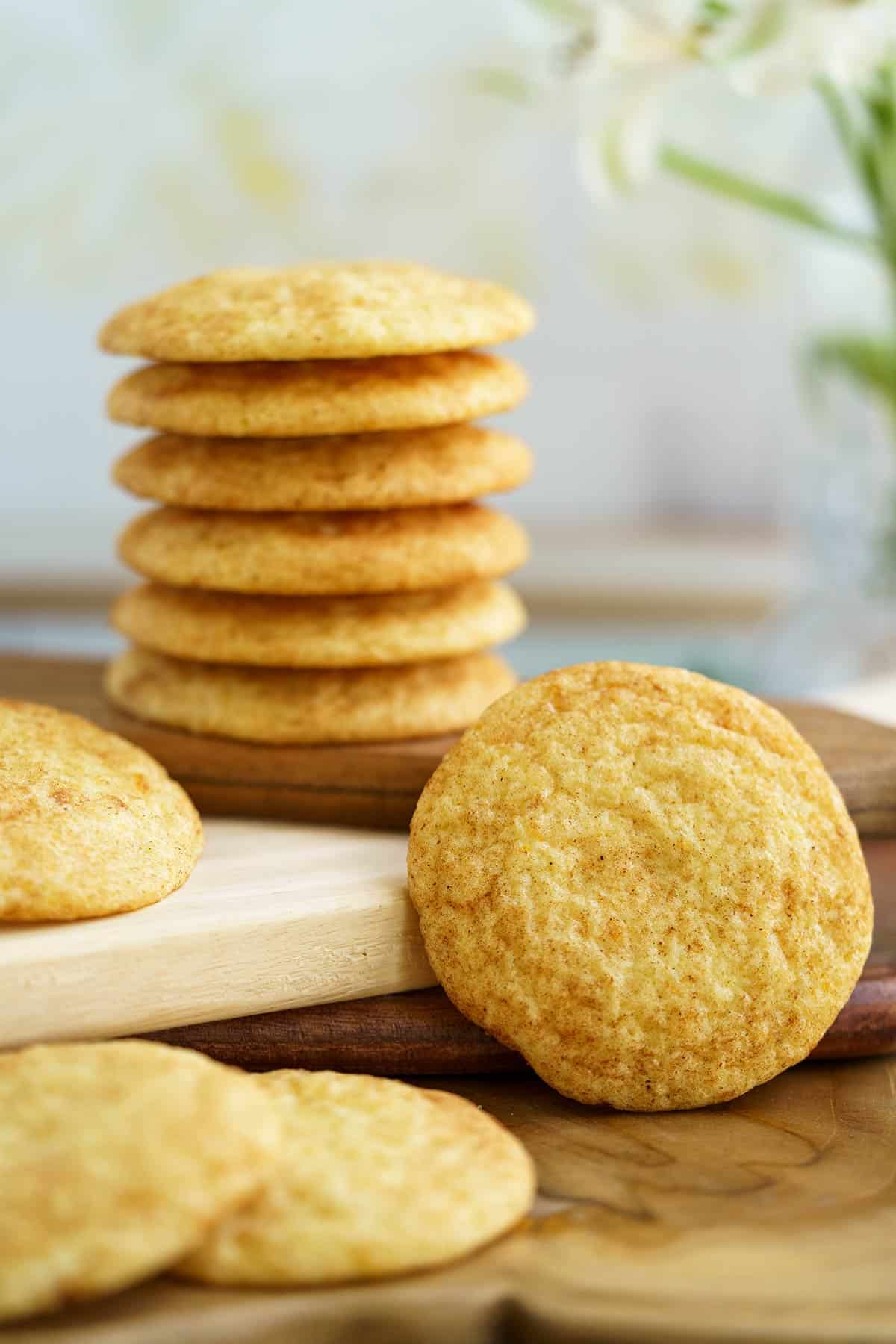 Orange Cardamom Snickerdoodle cookies with cookies stacked and front view.