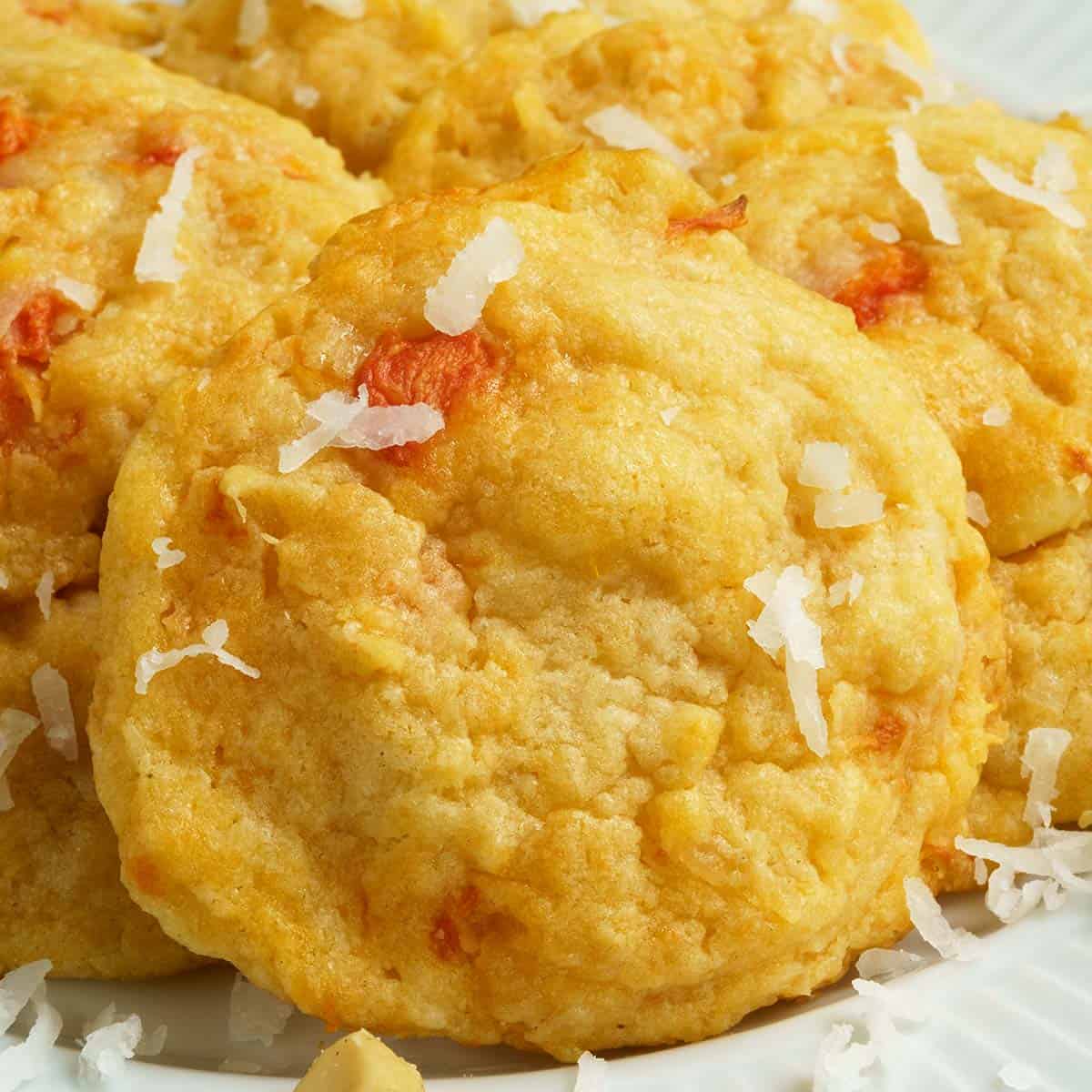 Papaya coconut and macadamia nut cookies sitting on a plate.