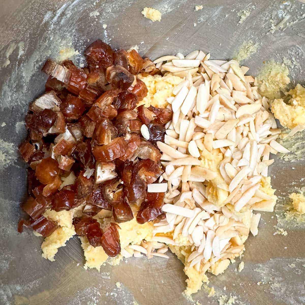 Flour mixture has been added than almonds pieces and chopped dates.