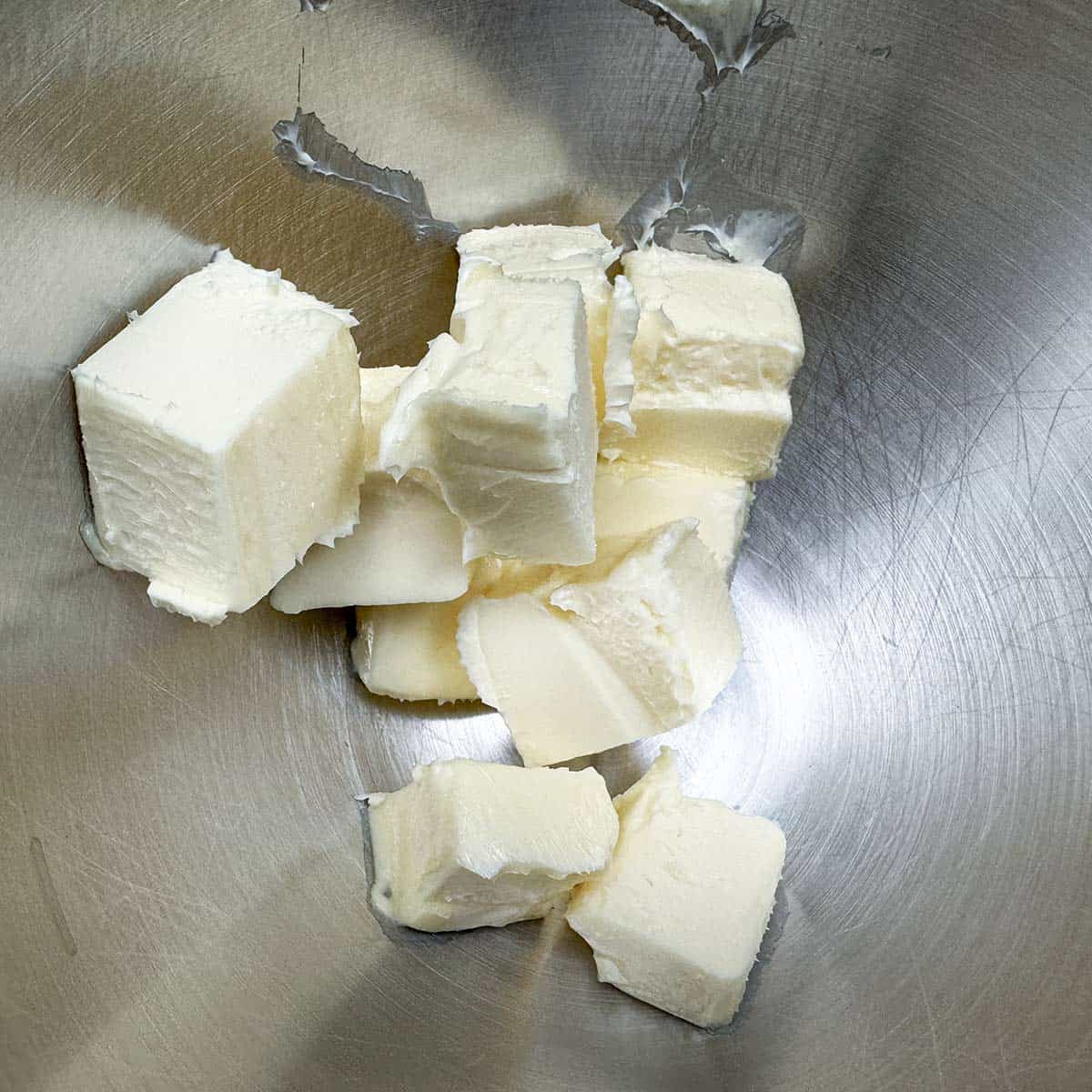 Cubed butter in a mixer bowl