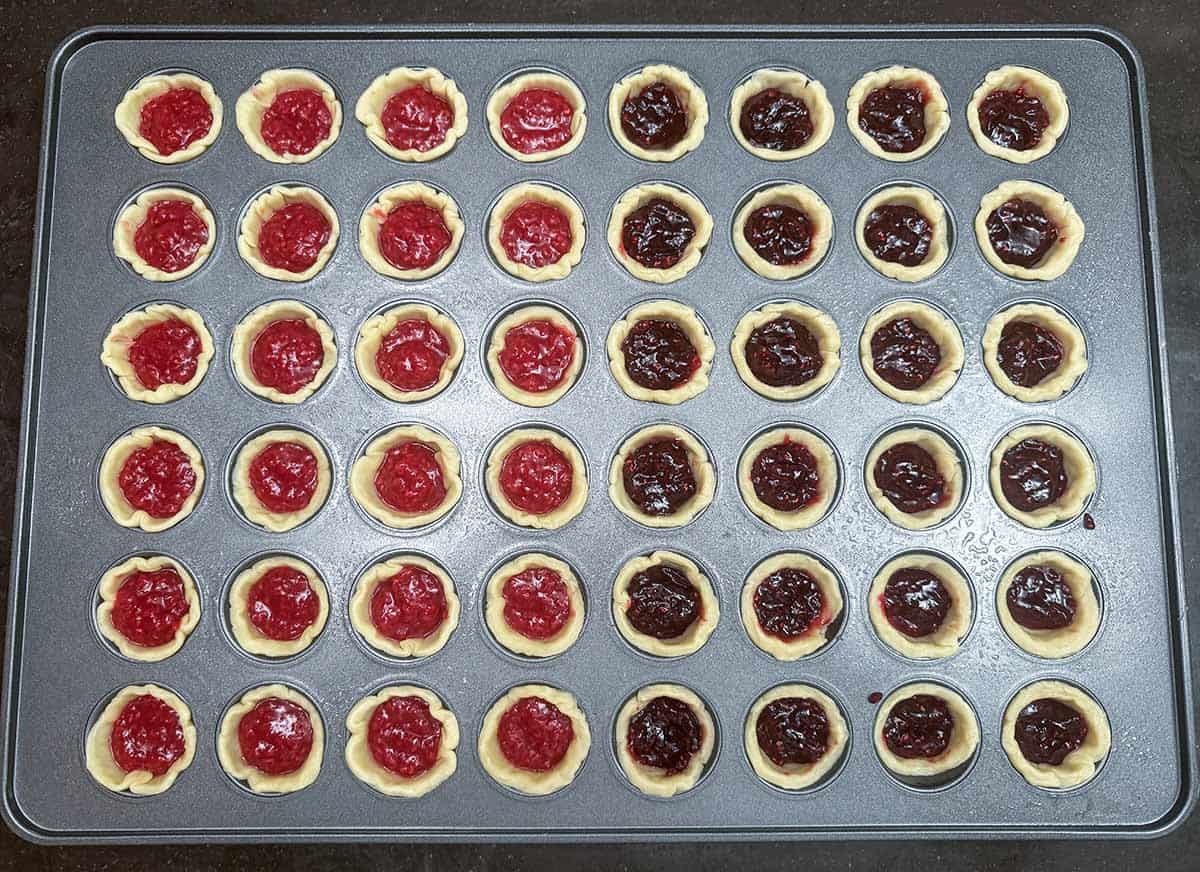 Cookie cups filled with half homemade jam and the other half with store bought preserves.