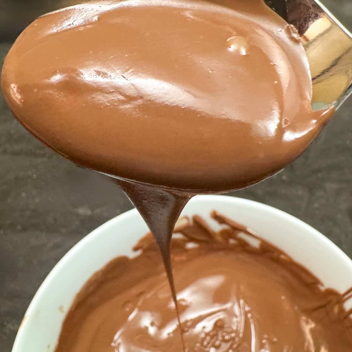 Showing melted milk chocolate that will be used for the drizzle on top of cookie cups.