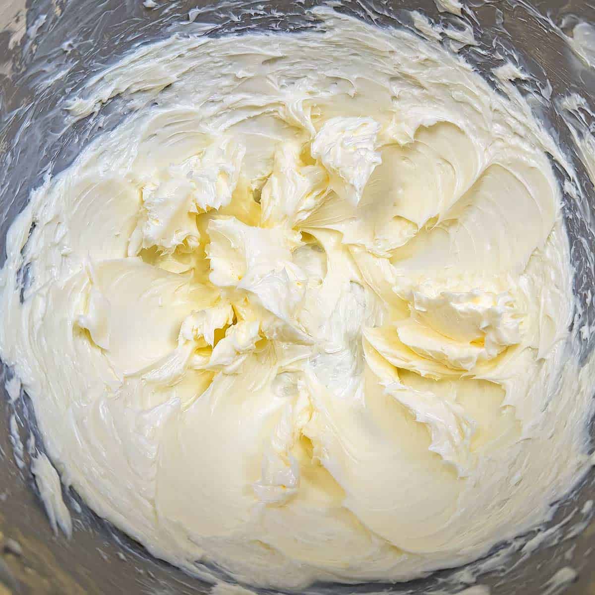 Creamed butter in a mixer bowl.