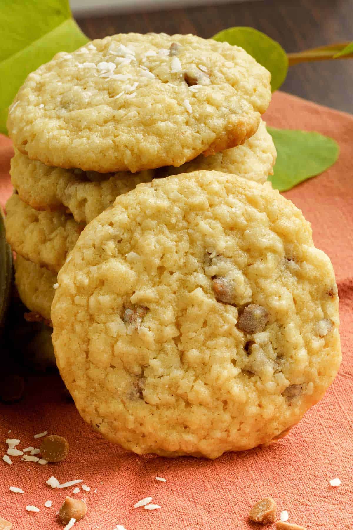 A view of chewy coconut and caramel sea salt cookie in a stack.