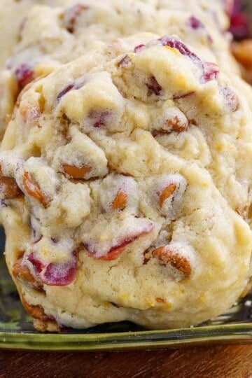 A front photo of a Cranberry Cinnamon Caramelized Wanut Cookie on a small plate.