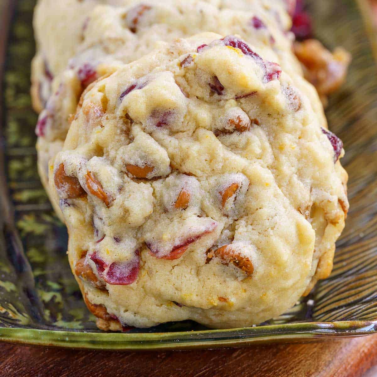 Close up of a cranberry cookie on a plate.