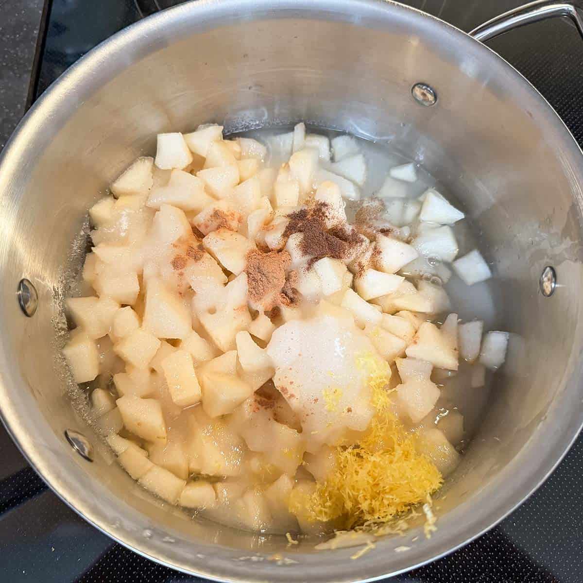 Adding all the ingredients into a sauce pan for the pear filling.