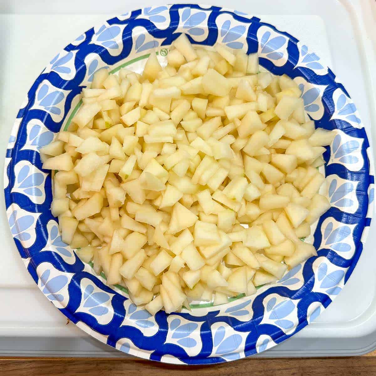 A pile of cutup pears on a plate.