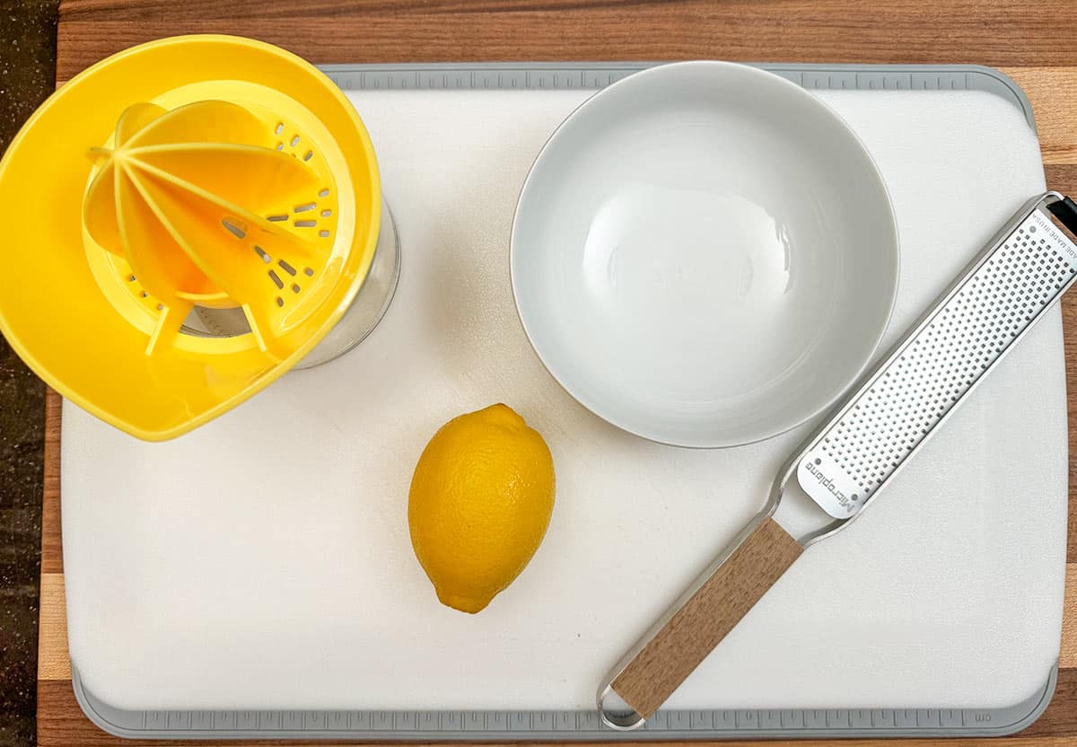 Setup for juicing and zesting a lemon.