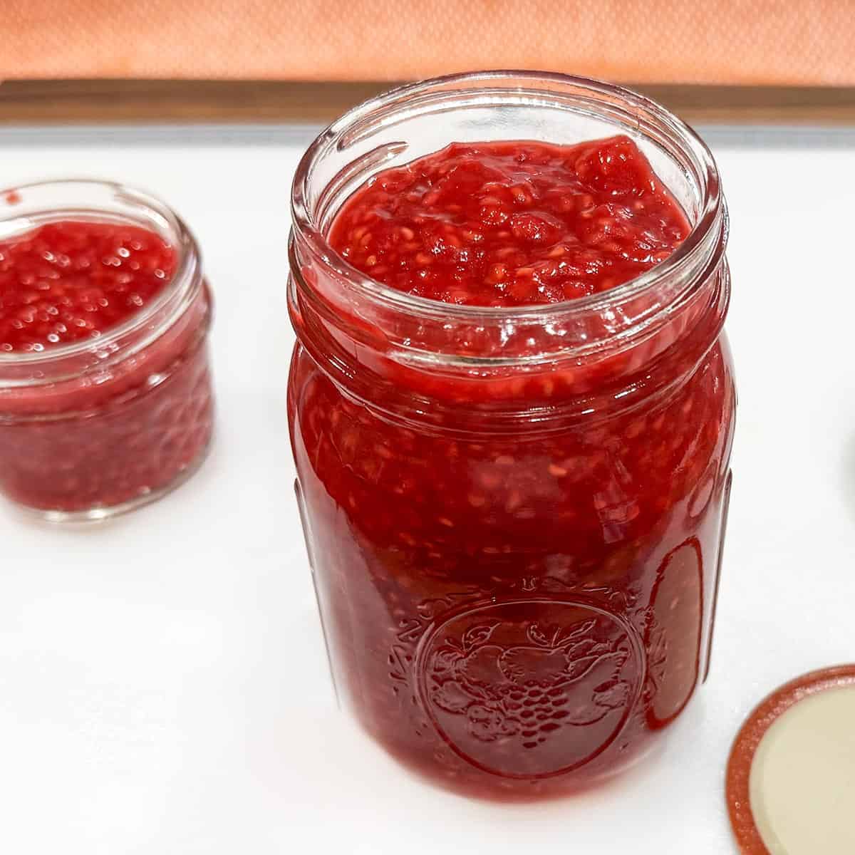 Filled mason jars with the raspberry filling.