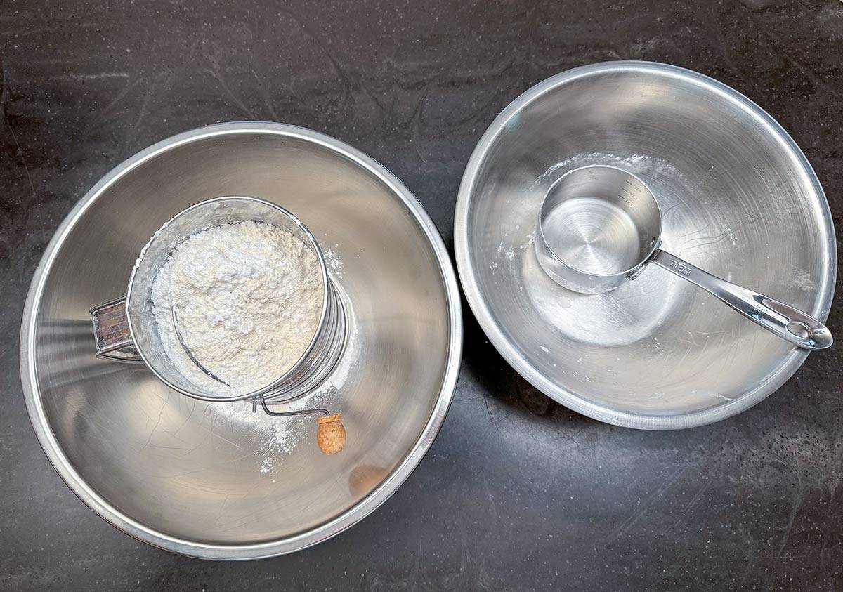 Sifting the flour and corn starch together into a bowl.