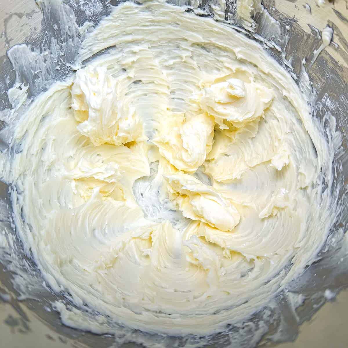 Creamed butter mixed with the powdered sugar creating soft swirls.