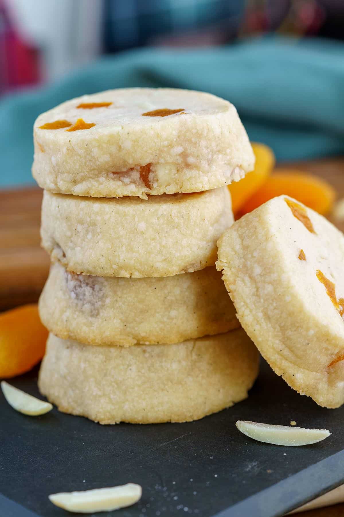 Apricot with vanilla bean cookies on a black board.