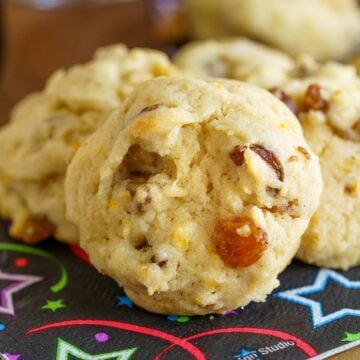 Close up of the orange pieces, golden raisin, cutup date pieces and chopped walnuts.