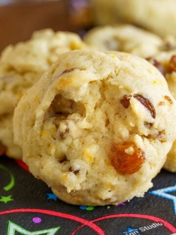 Close up of the orange pieces, golden raisin, cutup date pieces and chopped walnuts.