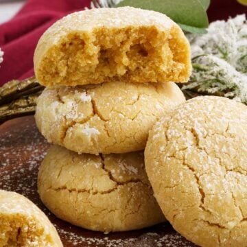 Brown butter cinnamon crinkle cookies stacked.