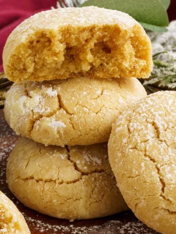 Brown butter cinnamon crinkle cookies stacked.