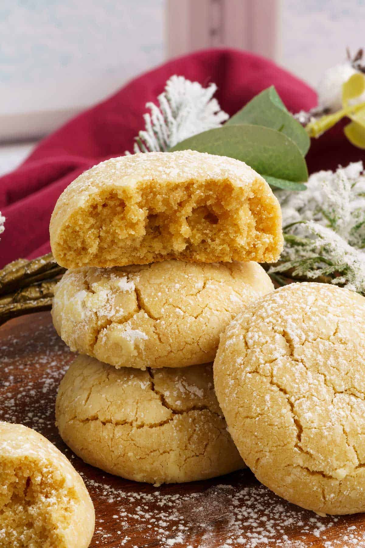 Stacked Brown butter cinnamon cookies with the top cookies broken in half to see inside.