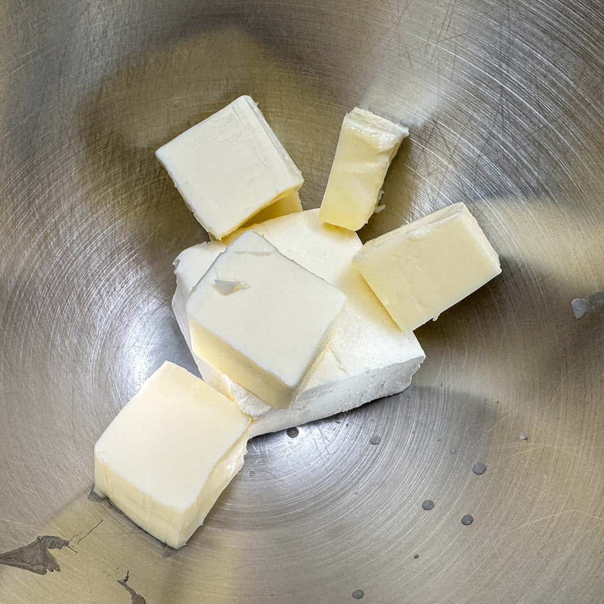 Cubed butter with the cream cheese in a mixer bowl.