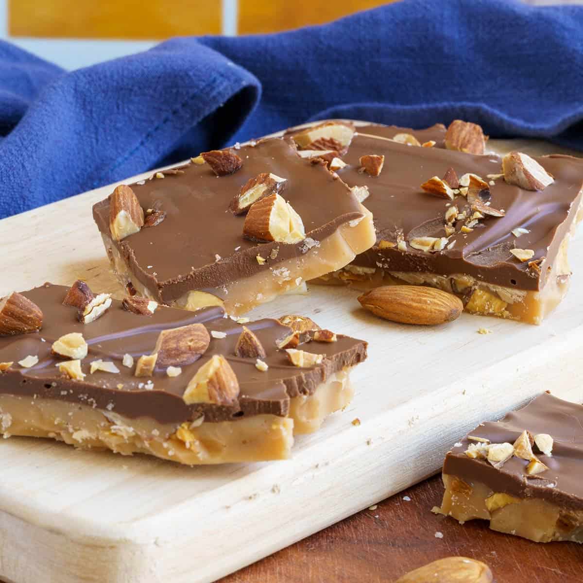 English Toffee with Almonds with a layer of chocolate on top with almonds.