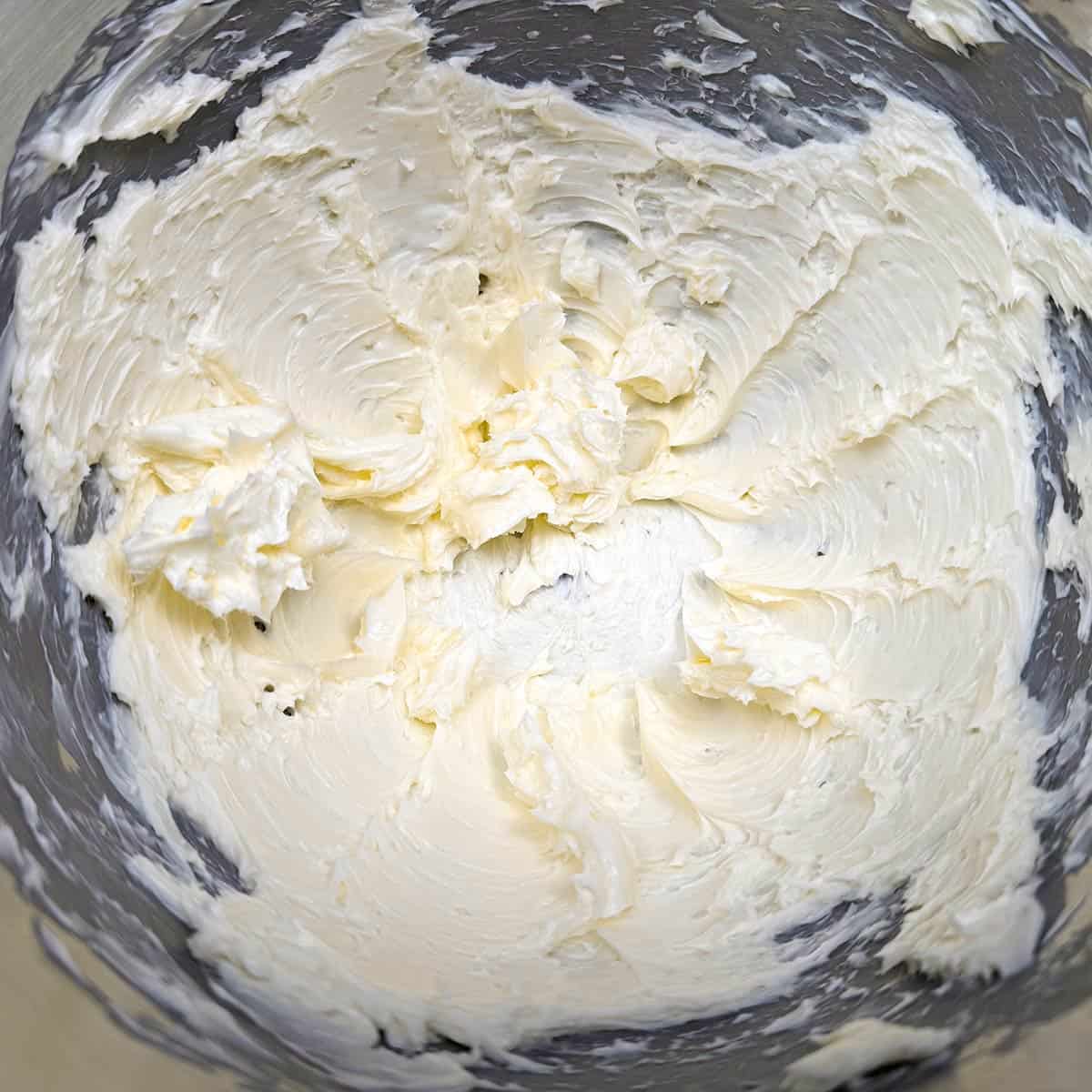 Creamed butter in a mixer bowl.