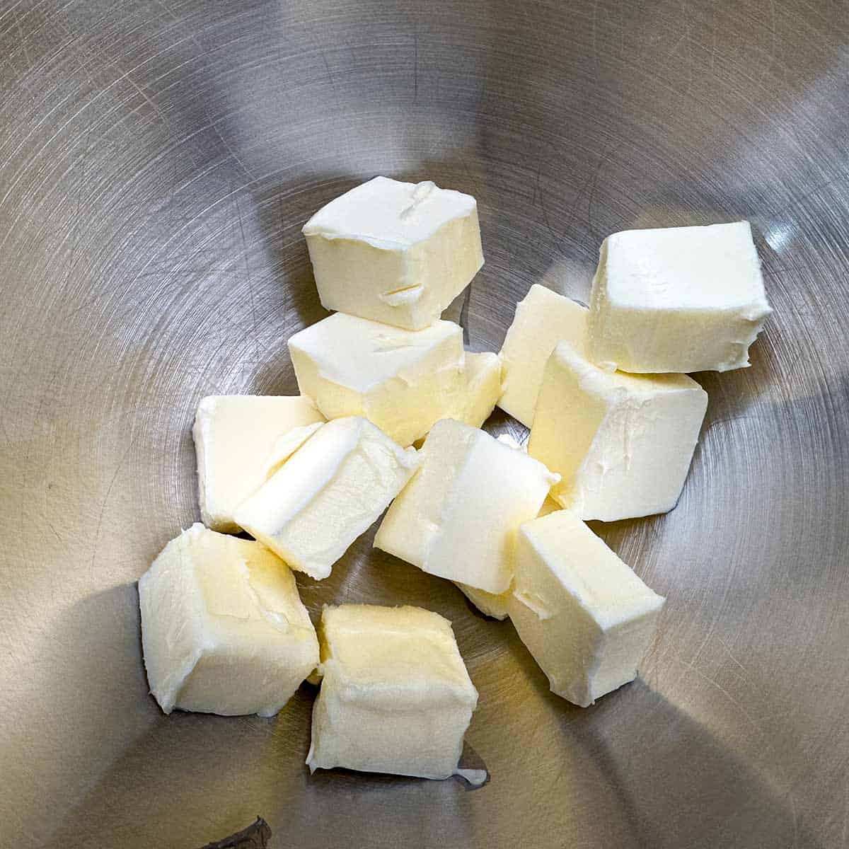 Two sticks of room temperature butter that has been cubed.