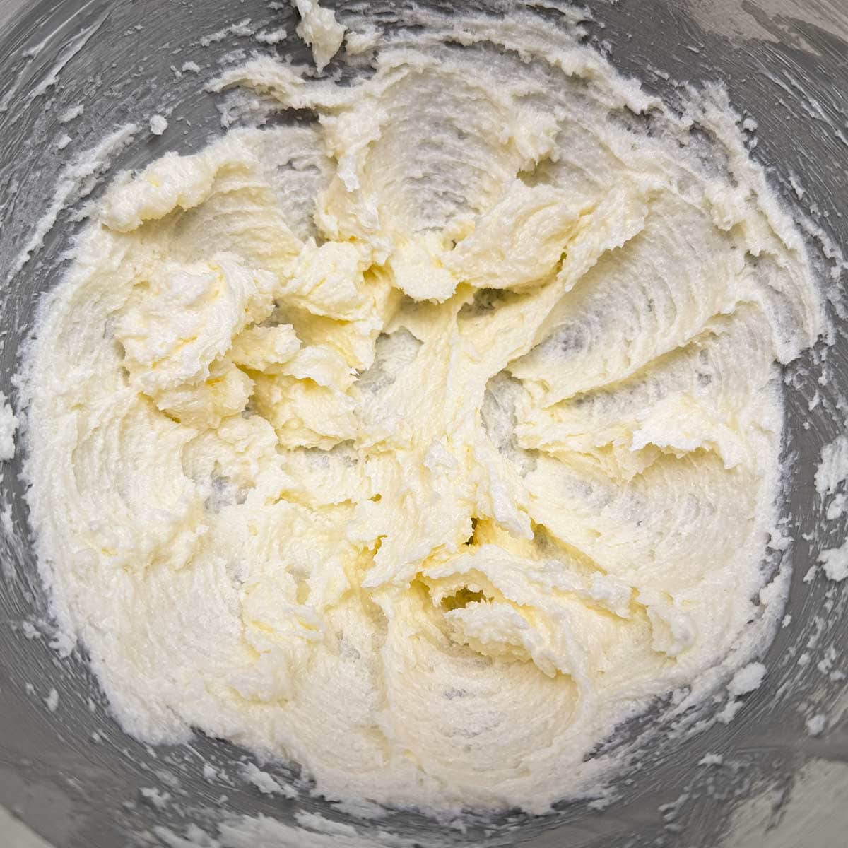 Mixed butter and sugar in the mixer bowl.