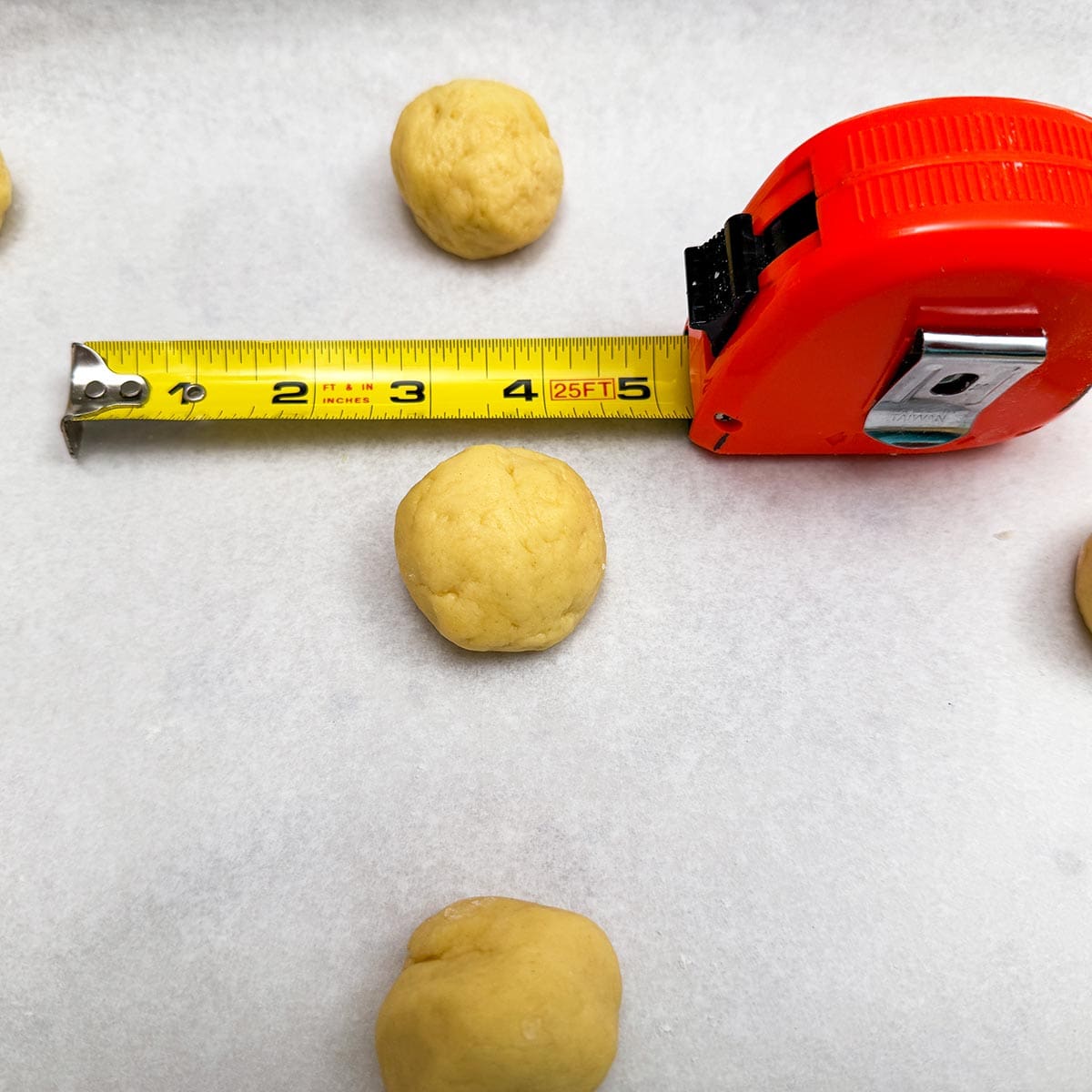 The cookie balls are 1-½ inch in size. Have 9 to a sheet pan.