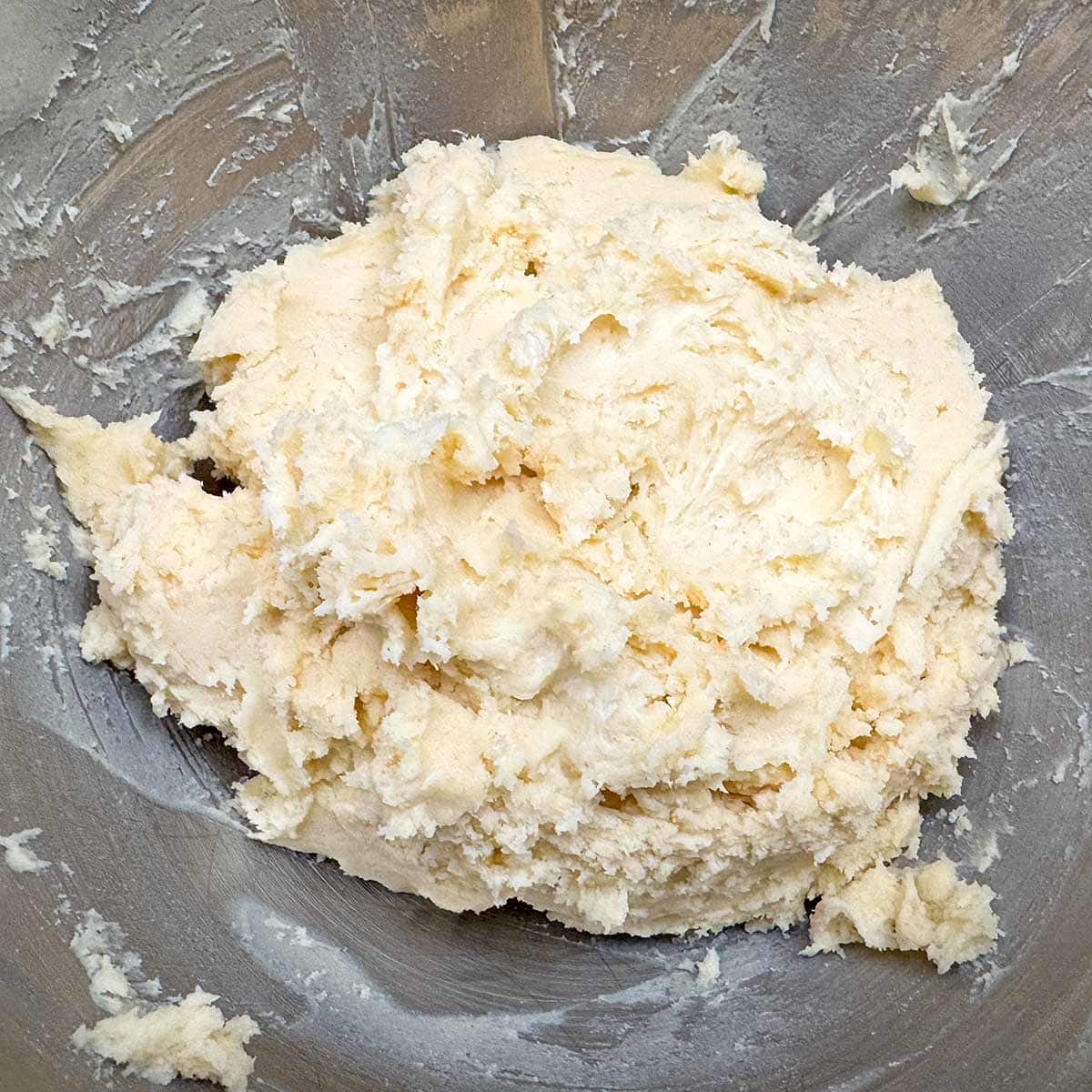 Finished mixing the cookie dough and it is sitting in a mixer bowl.