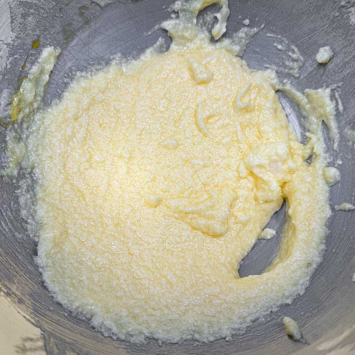 Adding eggs to the butter-sugar mixture.